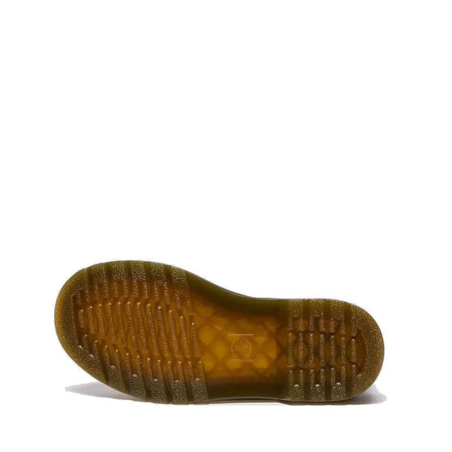 The image displays the translucent brownish rubber sole of the Dr Martens kids 1460 J Juniors Gingham Pink Lace Up Boot with zip, laid flat to show its tread with horizontal grooves and textured grip, against a plain white background., 50424, 50425, 50426, 190665779165, 190665779066, 190665779080, 190665779103