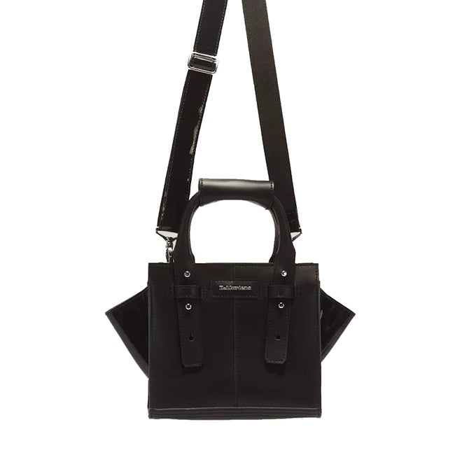 Introducing the Dr Martens Small Keiv Leather Tote Bag in Black—crafted from sleek black Kiev leather, this compact handbag features double handles and an adjustable shoulder strap with patent Lamper accents and side gussets. Subtle stitching details frame the front, finished with a rectangular logo patch for a refined touch. A versatile and stylish choice for everyday essentials.