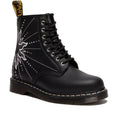 Introducing the Dr Martens 1460 Genix Solar Flare Black 8 Eye Boot: a black lace-up style in Genix Nappa leather, detailed with white stitching, a sunburst design, and a signature yellow pull tab.