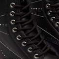 Close-up of Dr Martens 1460 Genix Solar Flare Black 8 Up Eye Boot, featuring black laces threaded through metal eyelets and white stitching details, emphasizing the lacing and boot’s exterior design., 190665742824, 190665742831, 190665742848, 190665742862, 190665742879, 190665742886
