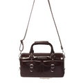 A cherry red Oxford Rub Off Dr Martens Top Handle Bag, featuring two front pockets, silver buckles, a signature top handle inspired by classic Dr Martens design, and an adjustable shoulder strap, photographed on a white background.