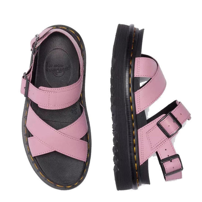 Dr Martens - Voss II Cross Strap Sandal in Dusty Rose Pink features black soles, crisscross straps, and buckle closures. The image shows one sandal from the top and another from the side., 50439, 190665777529, 190665777536, 190665777543, 190665777567, 50444, 50445