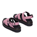 A pair of Dr Martens - Voss II Cross Strap Sandal in Dusty Rose Pink, featuring chunky black soles, ankle straps, and buckle closures, is shown from the back on a white background., 50439, 190665777529, 190665777536, 190665777543, 190665777567, 50444, 50445