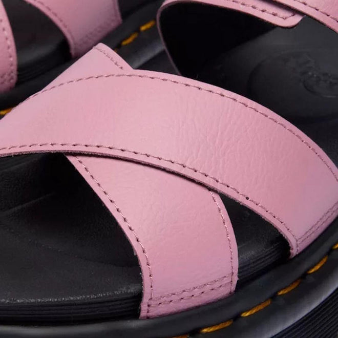 Close-up of Dr Martens - Voss II Cross Strap Sandal in Dusty Rose Pink, showcasing Athena Leather crisscross straps over a black footbed with signature yellow stitching on the sole., 50439, 190665777529, 190665777536, 190665777543, 190665777567, 50444, 50445