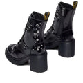Heel detail looking to the front of Dr Martens Chesney Hardware boots. showing the zip on the inside of the leg Black leather boots with studs and zippers on a white background.,
190665797701,
190665797718,
190665797732,, 49579, 190665797701, 190665797718, 190665797732, 49583, 49584, 49585, 49586