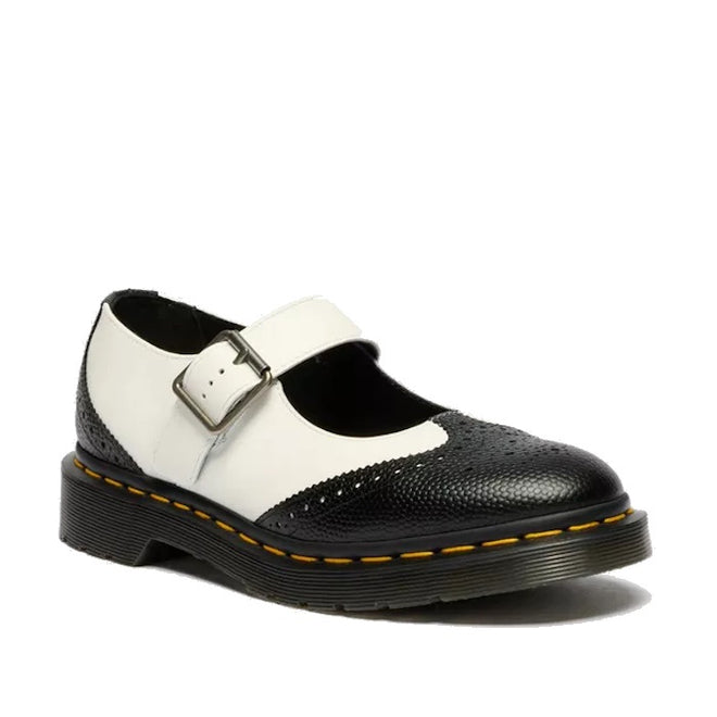 The Dr Martens Women's Mary Jane BW Black + White features black and white leather, a silver buckle, textured toe, yellow stitching on a thick black air-cushioned sole, and classic Goodyear welted construction.