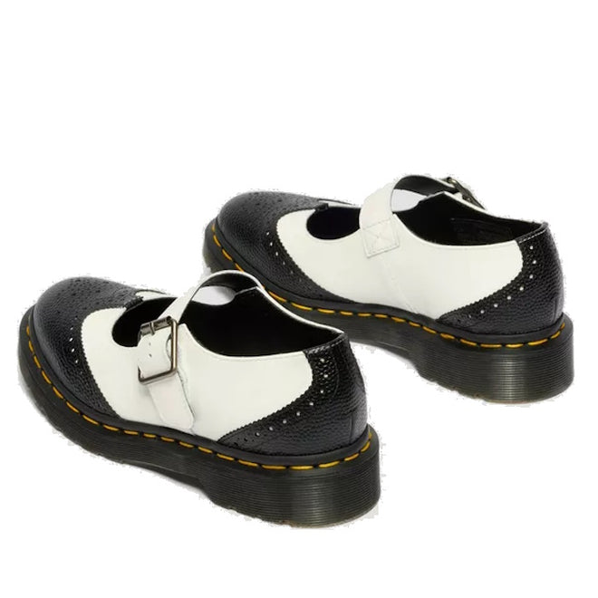 The Dr Martens Women's Mary Jane BW Black + White features a buckle strap, yellow stitching on the sole, perforated details on toe and heel, and an air-cushioned sole for added comfort., 190665785333, 190665785340, 190665785364, 50336, 50337