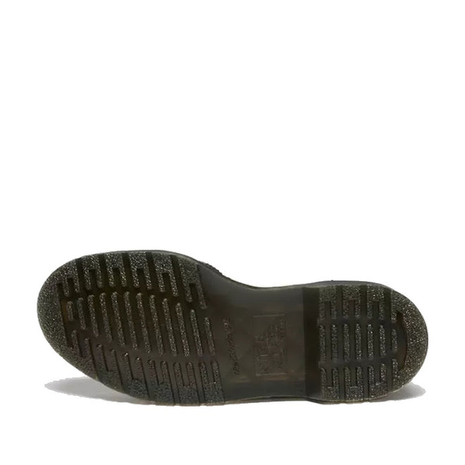 The image shows the bottom view of a Dr Martens - Women's Mary Jane BW Black + White shoe sole, featuring a textured, ridged tread pattern for grip. The slightly worn Goodyear welted sole is displayed against a white background., 190665785333, 190665785340, 190665785364, 50336, 50337