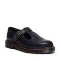 Right foot side and front view of a women's Dr Marten Polley T Bar in softer Ambassador Black  pebbled textured leather shoe with a buckle on a white background.,
