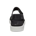 The Ecco Flowt Black Womens Active Sandal features a black minimalist design with a thick white sole, closed heel strap, open toe, visible stitching, and cushioned footbed for versatile comfort—shown from the back., 48662, 809704992501, 809704992518, 809704992525, 48666