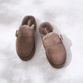 The Emu Womens Adison Smoke Grey Wool Mule Slipper Scuff, featuring a closed-toe slip-on design with a silver buckle and plush grey lining, is displayed on a light, textured surface., 50716, 9330071986417, 9330071986424, 9330071986431, 50720, 50721
