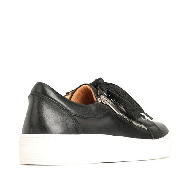 The EOS Joyce Leather Trainer is a black Italian aniline leather sneaker with a thick white sole, side zipper detail, anatomical insole, and black laces, shown from the back at a slight right angle., 9321191051628, 9321191051635, 9321191051642, 9321191051659, 9321191051666, 9321191051673, 9321191051611