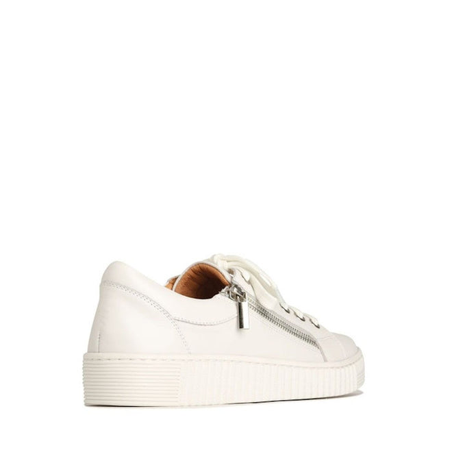 The EOS Joyce Leather Trainer features a white low-top design in Italian Aniline leather, with a thick sole, side zipper detail, and white laces, displayed from a rear side angle on a plain white background., 9321191044484, 9321191044491, 9321191044507, 9321191044514, 9321191044521, 36512, 36513