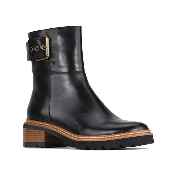 EOS Lindman women’s black leather boot with statement ankle buckle and chunky Stacked heel and Tread sole. Right Foot Side Front view.