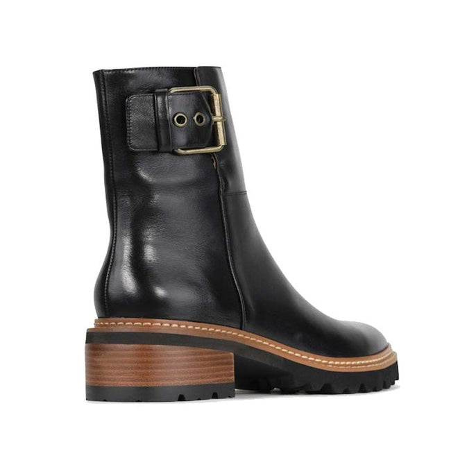 EOS Lindman women’s black leather boot with statement ankle buckle and chunky StackTread sole. Right Foot ouyside leg view from heel showing buckle,
45049,
45050,
45051,
45052,
45053,
45054,