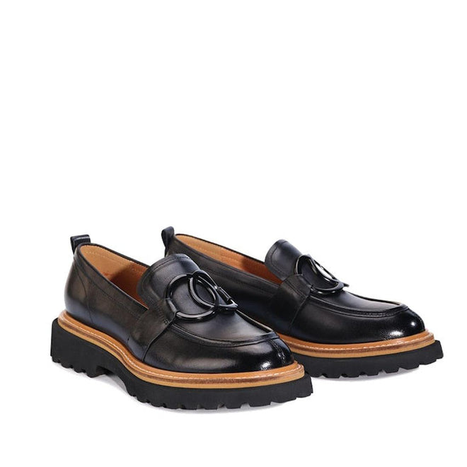 A shot of a pair of Black EOS Abbi loafers with an interlocking double ring design and showing the wraparound tan strip the seperates the upper from the sole accent.,
9321191254456,
9321191254463,
9321191254470,
9321191254487,
9321191254494,, 44246, 9321191254456, 9321191254463, 9321191254470, 9321191254487, 9321191254494, 44252