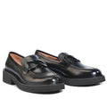 The EOS Womens Leia Loafer Slip In Black Leather features chunky cleated heels and decorative buckles, displayed against a white background., 50596, 9321190036855, 9321190036862, 9321190036879, 9321190036886, 9321190036893, 50602