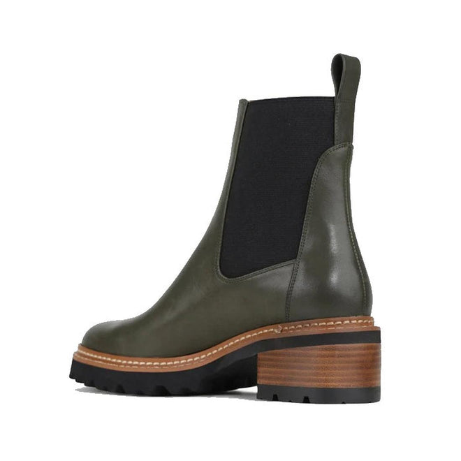 EOS Linear women’s boot in olive leather with side gussets, block heel, and lugged sole. Side View of Right Foot taken from heel showing detailing on inside of the leg.