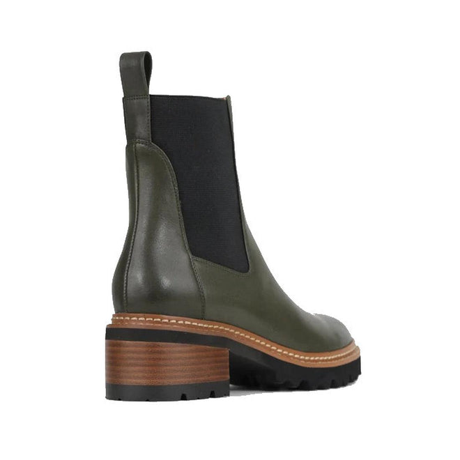 EOS Linear women’s boot in olive leather with side gussets, block heel, and lugged sole. Side View of Right Foot taken from heel showing detailing on outside of the leg.