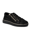 The Gelato Grapevine Leopard Womens Suede Embossed Sneaker in black features a leopard print, black laces, gold-accented side zip, and a thick black sole with metallic gold trim—an eye-catching addition to your casual sneaker collection.
