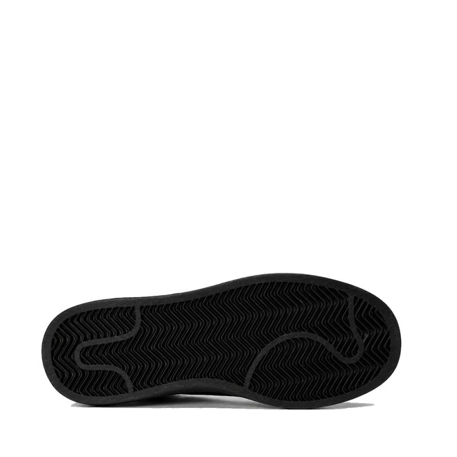 The black sole of the Gelato Grapevine Leopard Womens Suede Embossed Sneaker is shown horizontally against a white background, displaying its textured, wavy tread pattern with the toe facing right., 52093, 52094, 52095, 52096, 52097, 52098, 52099