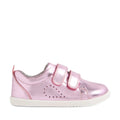 The Bobux Iwalk Toddlers Grass Court Pink Metallic Leather Trainer features shiny pink leather, two Velcro straps, small perforated side holes, a cushioned collar, and a white rubber sole—shown in profile on a white background. Perfect toddler trainers inspired by the classic Bobux Grass Court style.