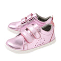 Shiny pink metallic toddler shoes with white soles, featuring two velcro straps and small perforated dots on the side for decoration, these Bobux Iwalk Toddlers Grass Court Pink Metallic Leather Trainers are perfect kids’ leather sneakers for everyday adventures.