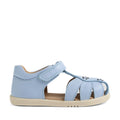 Introducing the Bobux IWalk Holly Toddlers Sandal in Skyway Blue—a light blue children’s sandal featuring a closed heel, open toe, and adjustable Velcro strap. Designed for comfort, these leather sandals have a soft sole and delightful flower-shaped cutouts on the top, making them both practical and charming for little ones. Shown against a white background.