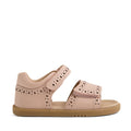 The Bobux IWalk Logan Toddlers Sandal in Cameo Rose Pink features an open toe design, two Velcro straps, decorative cutout patterns, a closed heel, and a tan rubber sole; shown in side profile against a white background.