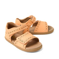 A pair of Bobux IWalk Logan Toddlers Sandal in Peach Jelly—leather open-toe sandals for girls featuring decorative cutouts and two adjustable velcro straps—are displayed against a white background, perfectly highlighting their stylish comfort.