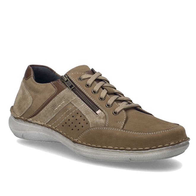 The Josef Seibel New Anvers 87 Men’s Casual Shoe w/ Zip in Beige Sand is a men’s lace-up casual shoe crafted from nubuck leather, featuring a lace-up front, side zipper, perforated detailing, and a white rubber sole. Designed for comfortable walking, the shoe is shown at an angle on a white background.