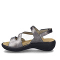 A women’s sandal in anthrazit pewter, the Josef Seibel Ibiza 70 Leather Comfort Sandal features a metallic gray finish, open toe, cut-out sides, an adjustable ankle strap, a cushioned beige insole, and a black slightly elevated sole., 53175, 4062838861907, 4062838861914, 4062838861921, 53179, 53180