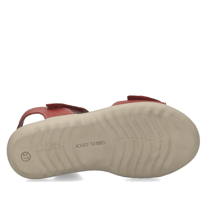The image displays the bottom view of the Josef Seibel Juliet 03 Womens Leather Comfort Sandal in red leather, featuring a light beige sole. The sole showcases the JOSEF SEIBEL brand name printed in the center, along with a small smiley face near the heel, emphasizing this stylish and comfortable option for women’s sandals.