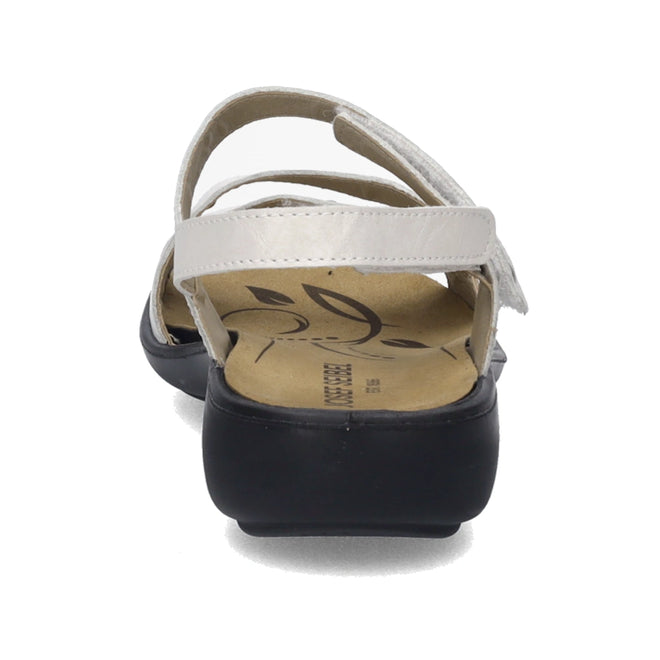 A close-up rear view of the Josef Seibel Ibiza 70 Women’s Leather Comfort Sandal in white, featuring soft leather straps and a contrasting black sole with a floral-patterned insole—a stylish and comfortable choice for your women’s sandal collection., 4062838862096, 4062838862102, 4062838862119, 4062838862126, 4062838862133, 4062838862140