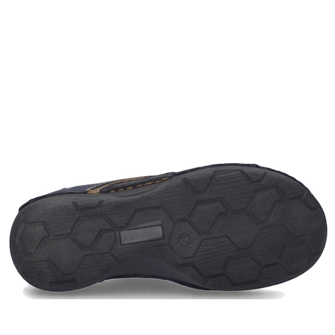 The image shows the bottom sole of the Josef Seibel Fergy 41 Women’s Casual Lace Up Shoe in Ocean Blue, featuring a hexagonal tread pattern and a rectangular brand tag in the center, emphasizing the meticulous craftsmanship characteristic of this premium footwear., 53128, 4062838921991, 4062838922004, 4062838922011, 53132, 53133