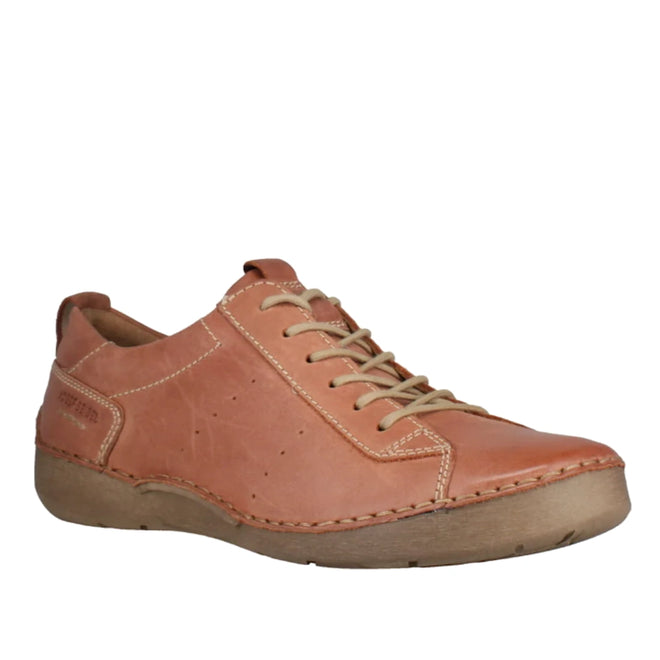 Introducing the Josef Seibel Fergy 56 Women’s Casual Lace Up Shoe in Cognac Tan, expertly crafted from premium smooth leather in a light brown shade. This stylish shoe features beige laces, prominent stitching details, and a comfortable tan rubber sole, as displayed from a front-side perspective.