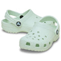 A pair toddlers Crocs Classic Clog Sandal of light green clogs on a white background