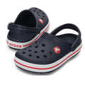 Kids Crocs Crocband Navy blue and white Crocs clogs with red accents on a white background and no holes around the side of the clog.,
