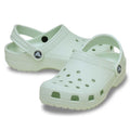 Pair of light green mint kids classic sandals clogs on a white background