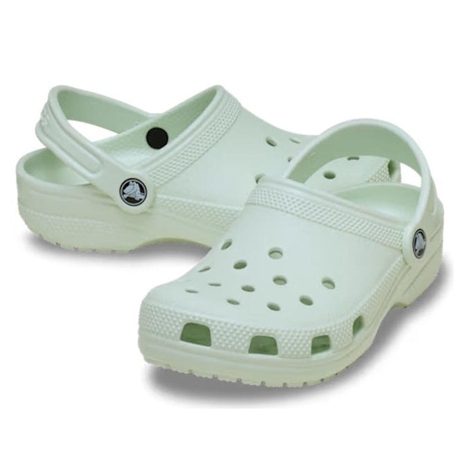 Pair of light green mint kids classic sandals clogs on a white background