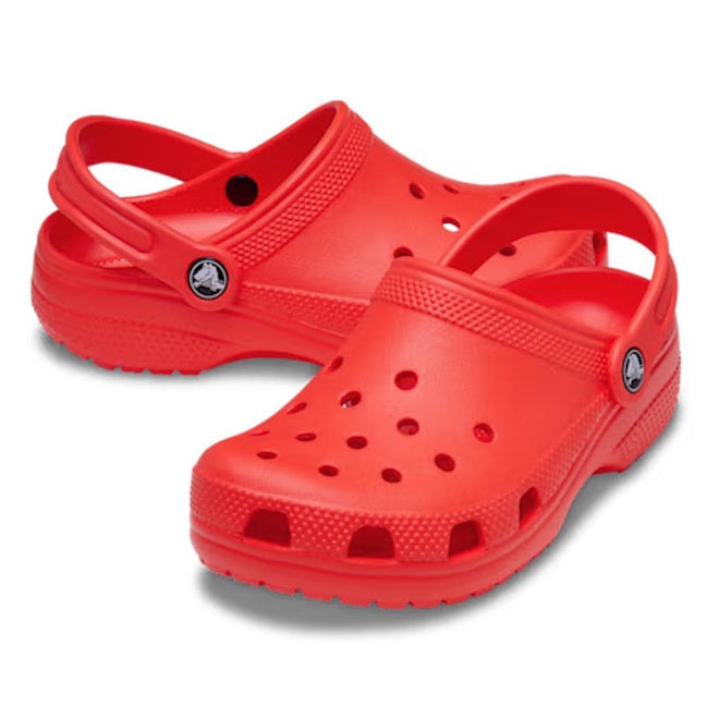a pair of kids bright orange (starfish) classic croc clog sandals 