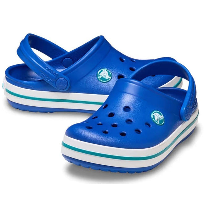 The Crocs Kids Crocband Classic Clog in Blue Bolt Teal Youths features white and turquoise striped soles, Crocs Comfort, top ventilation holes, and adjustable heel straps.