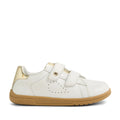 The Bobux Kid+ Plus KP Maverick Leather Sneaker White Gold features a white leather upper with perforated side detailing, a tan sole, gold heel accent, and two adjustable hook-and-loop straps for a secure fit. The BOBUX logo is displayed on the outer side of the sole near the heel. Designed for comfort and convenience, these sneakers offer easy strap closures for kids.