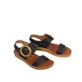 The Los Cabos Damas Black Light Flexible Sandal Jandal features black cross-over leather straps, a tan cushioned footbed, light brown soles, and large round gold buckles on the side straps., 39784, 9321191213002, 9321191213019, 9321191213026, 9321191213033, 9321191213040, 9321191213057