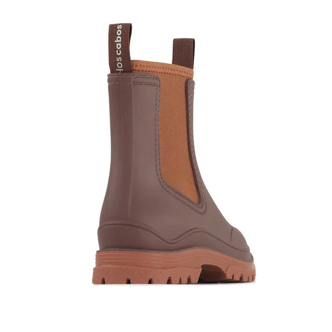 The Los Cabos Amelia Chocolate Ankle Rain Boot Waterproof features a chic brown ankle-length design, tan elastic side panel, comfy neoprene lining, back pull tab with "los cabos" label, and a thick treaded sole. Boot is angled to display the side and back., 50781, 9321190004915, 9321190004922, 9321190004939, 9321190004946, 9321190004953, 9321190004960