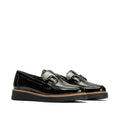 The Pitillos Womens Black Patent Slip On Loafer 10760 features metallic buckles, thick ridged black soles, and a brown trim around the base. Displayed against a plain white background.,8445191661319, 8445191661326, 8445191661333, 8445191661340, 8445191661357, 51930