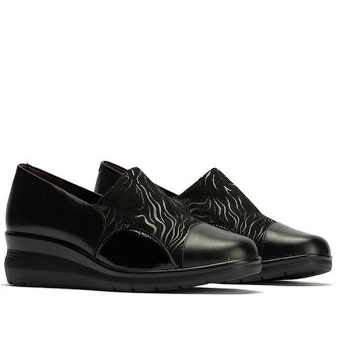 The Pitillos Womens Lycra and Patent Leather Shoe 10731 features black uppers with subtle wave patterns, glossy patent leather toe caps and heels, a removable insole, and wedge soles, shown against a white background.