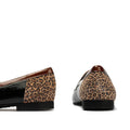 The Pitillos Womens Black Flat Patent Loafer Moccasin 10870 features black patent leather, brown trim, and a chic leopard accent on the heel, displayed from side and back angles against a white background., 8445191690432, 8445191690449, 8445191690456, 8445191690463, 51917, 51918