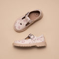 Two Pretty Brave Girls Maddison Winter Bloom Pink Leather Mary Jane T Bar shoes are displayed on a beige background. One shoe, shown from above, features a heart-shaped cutout near the toe and floral patterns with silver buckles., 9420075362840, 9420075362833, 9420075362826, 9420075362819, 9420075362802, 9420075362796, 50965, 50966, 50967, 50968