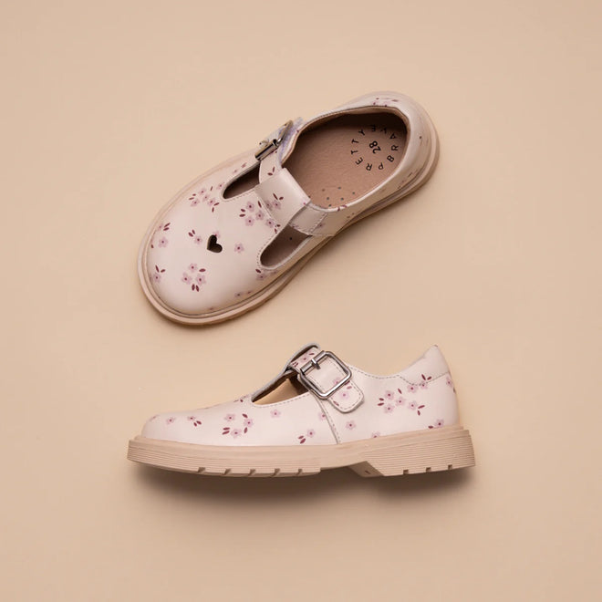 Two Pretty Brave Girls Maddison Winter Bloom Pink Leather Mary Jane T Bar shoes are displayed on a beige background. One shoe, shown from above, features a heart-shaped cutout near the toe and floral patterns with silver buckles., 9420075362840, 9420075362833, 9420075362826, 9420075362819, 9420075362802, 9420075362796, 50965, 50966, 50967, 50968